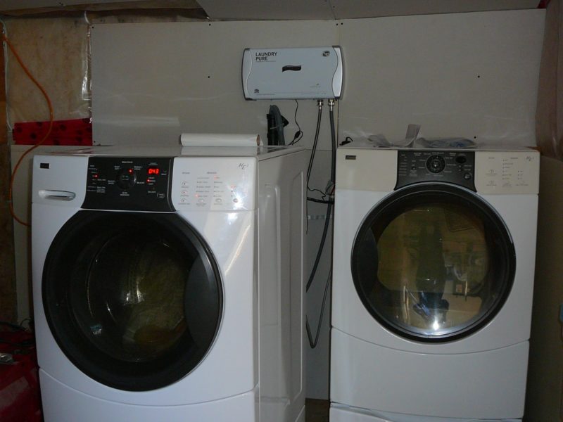 Front load washer and dryer with the laundry Pure 2.0 hooked to the washer